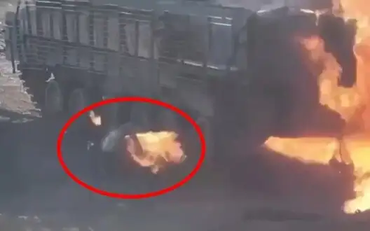 Occupier is floundering in fire after crawling out from under burning armored vehicle. VIDEO 18+