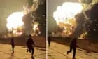 People flee burning Russian oil refinery after reported drone attack – video