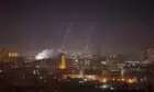 Russia launches huge Ukraine drone attack on eve of third anniversary of invasion – video report