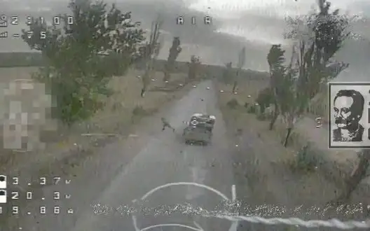 Two occupiers jump out of moving vehicle to evade drone strike. VIDEO