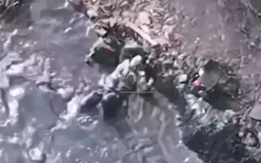 Wounded Russian stormtrooper floundering in puddle. VIDEO