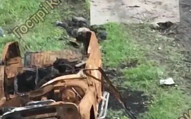 About dozen bodies of occupiers lie on battlefield around burnt UAZ truck. VIDEO