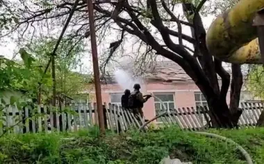 Rescuers extinguish fire at an educational facility after Russian shelling in Sumy region. PHOTO