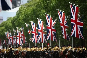Thousands of people gather near Buckingham Palace to mark the 80th anniversary of V-E Day
