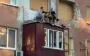 Two Kherson residents gathered on remains of balcony of destroyed apartment on third floor of high-rise building. VIDEO