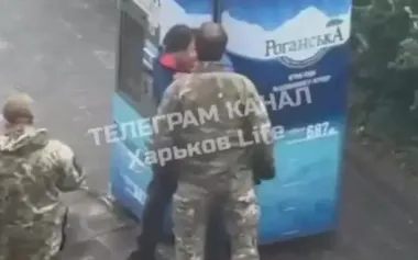 Four TCR employees are watching as their colleague conducting "alert measures" in Kharkiv and beating man in civilian clothes. VIDEO