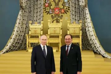 Malaysian PM raises downing of MH17 with Putin as captain’s son calls for justice