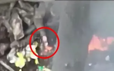 After drone arrives, occupier lights cigarette from burning body of his comrade. VIDEO