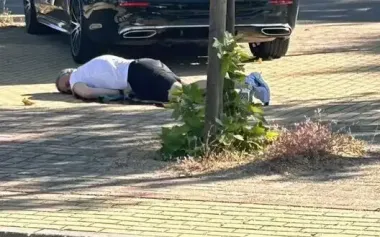 Murdered Portnov lies on ground. PHOTO