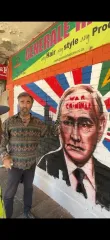 "Военный преступник": ведущий из Украины "исправил" граффити с Путиным в Южной Африке (видео)