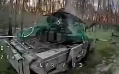 Drone operators from 63rd SMB hunt down Russian tank in forest. VIDEO