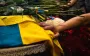 "Погибли, спасая других": в Киеве попрощались с тремя спасателями, которых убила Россия