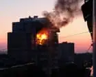 Waves of Russian drones and missiles kill at least 14 people in Kyiv – video