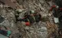 Man’s body pulled from Kyiv rubble; parents had waited at the ruins all day