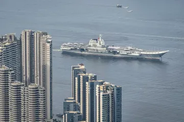Chinese aircraft carrier sails into Hong Kong to boost patriotism
