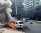 Shocked Ukrainians leave apartment block after Russian bomb hits Kharkiv – video