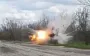 Occupier picks up unknown object, carries it to side of road and is blown up by explosion. VIDEO