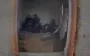 Drone flies through window into room where four occupiers are sitting. VIDEO