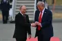 Trump rolls out the red carpet for Putin as leaders shake hands on Alaska tarmac and ride to summit together