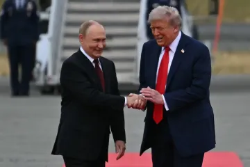 Trump rolls out the red carpet for Putin as leaders shake hands on Alaska tarmac and ride to summit together