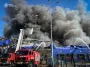 Пытаются локализовать огонь: появились новые кадры последствий удара по "Эпицентру" (видео)