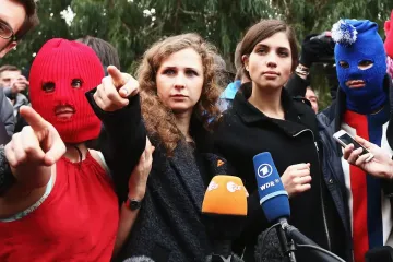 Russia sentences Pussy Riot members in absentia to jail for anti-war messages 