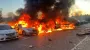 Aftermath of Russian attack on Kyiv Oblast: cars and house on fire – photos