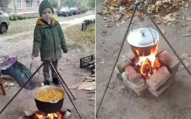 Residents cook outdoors amid power and gas outages in Shostka, Sumy region. PHOTOS