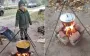 Residents cook outdoors amid power and gas outages in Shostka, Sumy region. PHOTOS