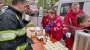 Ukrainian Red Cross volunteers assist firefighters during Kyiv fire response