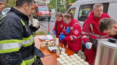 Ukrainian Red Cross volunteers assist firefighters during Kyiv fire response