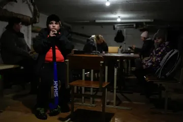 Photos show Ukrainians dealing with blackouts as Russia strikes energy infrastructure