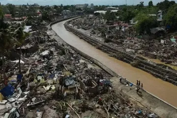 Понад 100 загиблих, затоплені вулиці і знищені будинки: тайфун зачепив дві країни (фото)