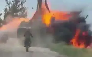 Russian motorised assault trooper watches as armoured vehicle with accomplices disappears in flames after hitting mine. VIDEO