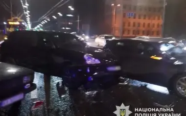 Drunk Porsche driver in Kyiv caused accident, hit passenger and used weapon, - police. PHOTO