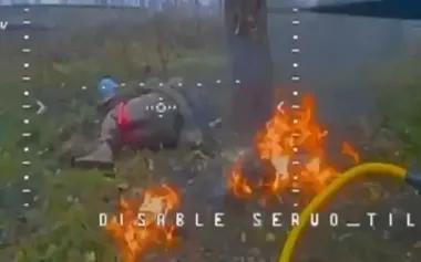 Drone hit occupier in back as he lay near fire. VIDEO